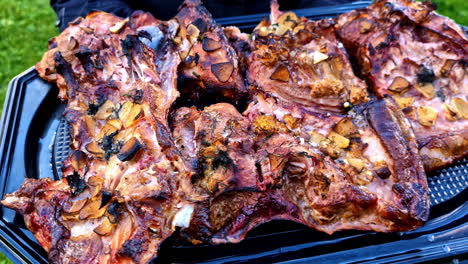grilled meat platter featuring charred cuts ready for serving at an outdoor bbq