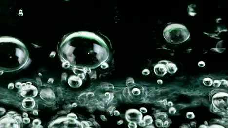 water oil bubbles  behind glass background