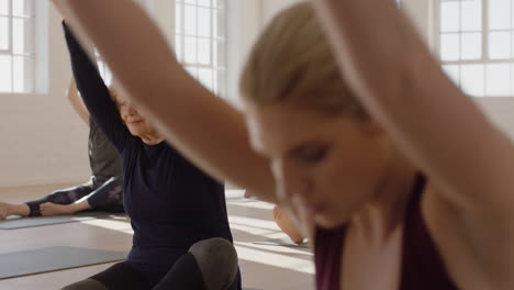 yoga class of healthy mature woman practicing head to knee forward bend pose enjoying morning physical fitness workout in studio