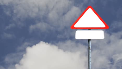 blank signboard post with copy space against clouds in the blue sky