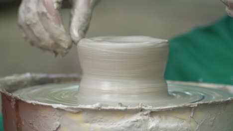 pot maker hand crafting pottery