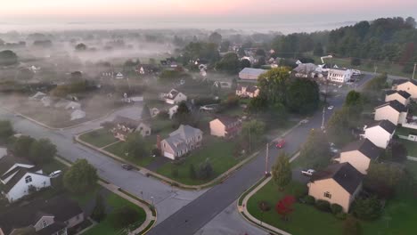 fog during sunrise over american neighborhood