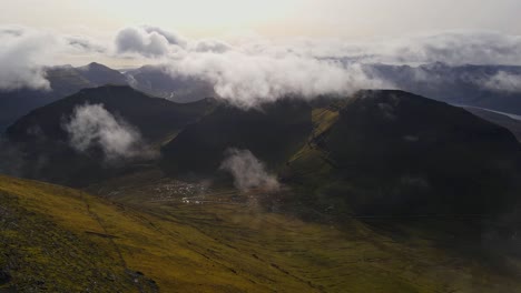 Drone-footage-of-a-green-valley-near-the-Slættaratindur-summit-on-the-Eysturoy-island-in-the-Faroe-Islands