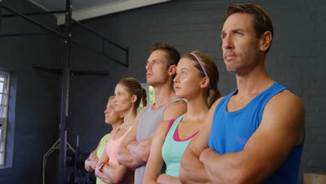 Serious-fit-people-posing-together-in-gym