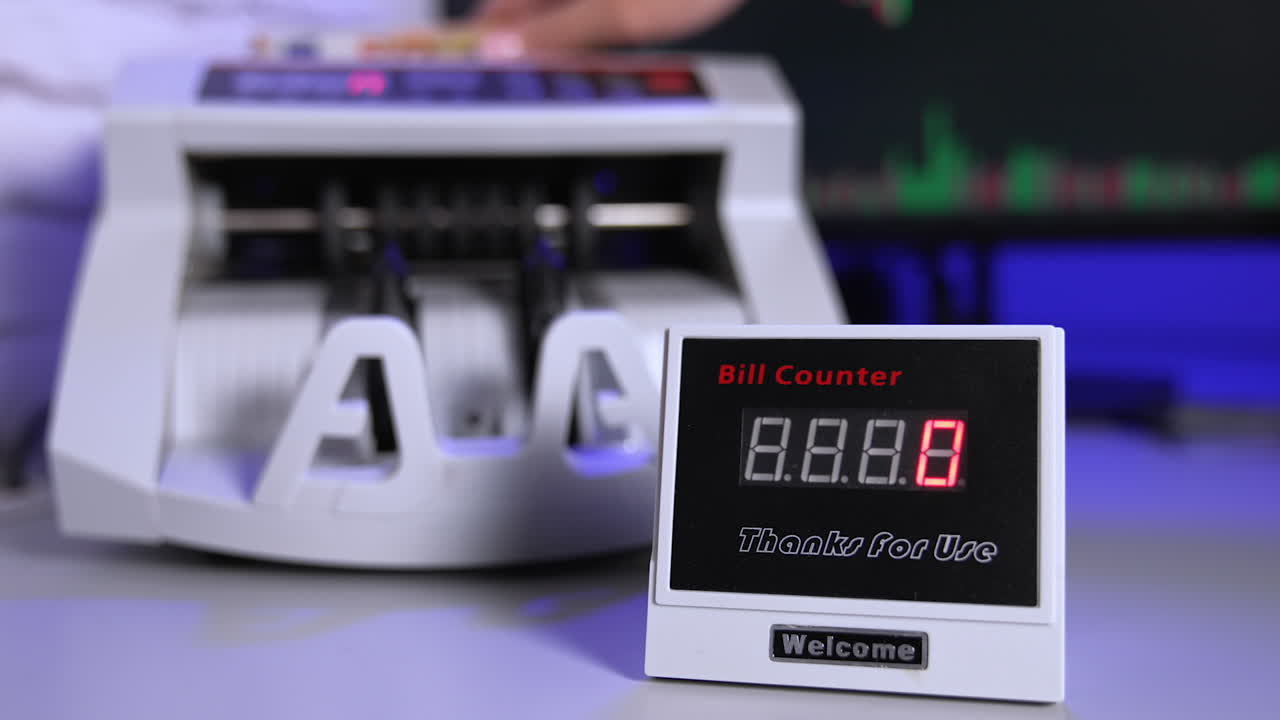 Bank cash counter machine with a stack of dollars. Horizontal view of the finance business money counting. Money and business concept
