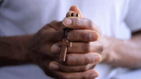 black man praying to god with cross and hands together caribbean man praying with white background stock video stock footage