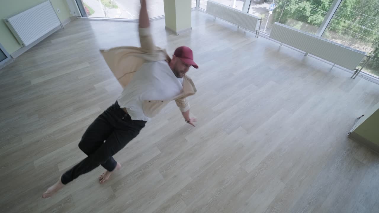 hombre bailando breakdance en un estudio moderno