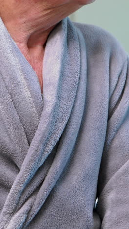 portrait of senior man in bathrobe