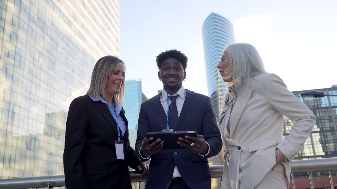 Business People Discussing on a Tablet