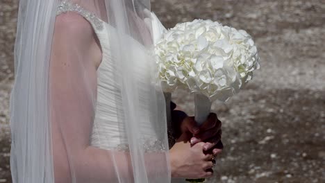 shot-of-bride---groom-with-wedding-flower