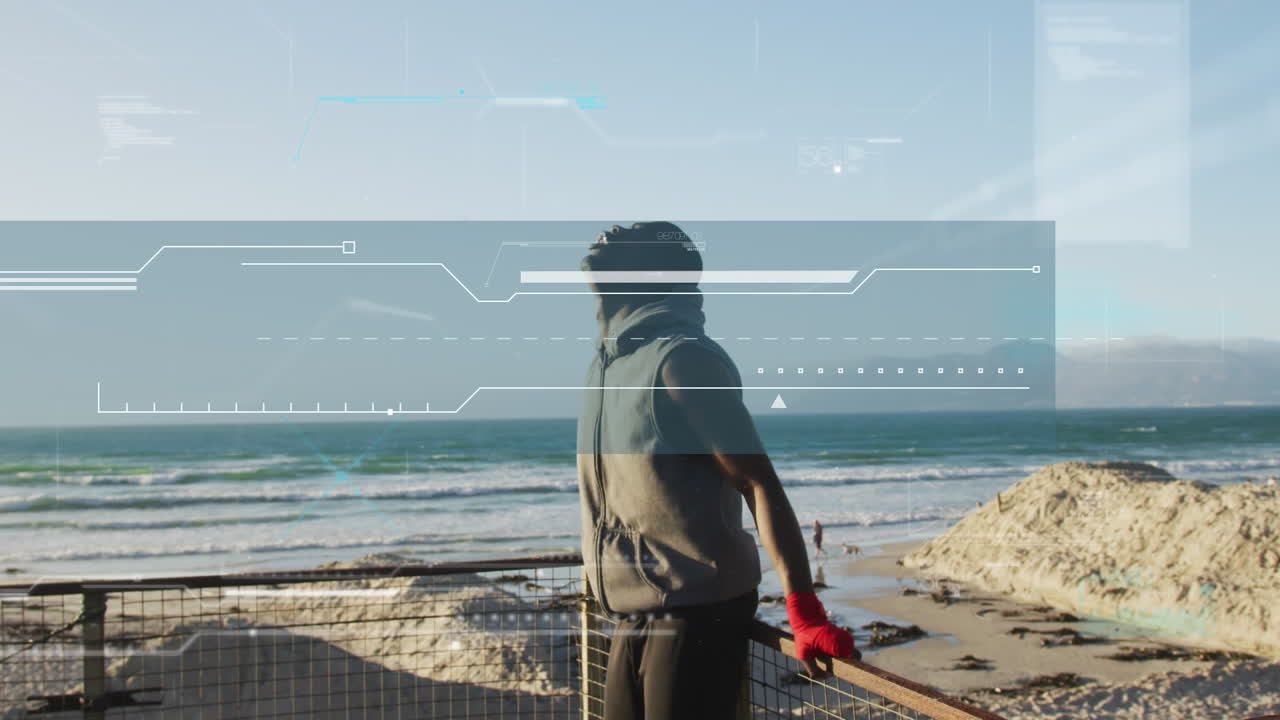 Animation of digital interface over african american man training by sea taking a break