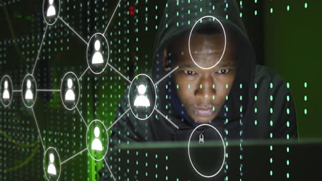 animation of icons and data processing over african american male hacker using laptop