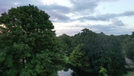 Paddle-boarding-at-Flatford-in-Suffolk-at-sunrise-on-a-wonderfully-calm-day-in-summer