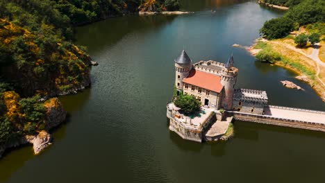 aerial shot around chateau de la roche on a sunny day on the loire river near roanne city in loire departement, auvergne rhone alpes region, france