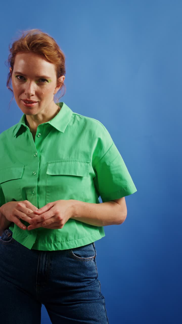 Woman in Green Shirt and Blue Jeans