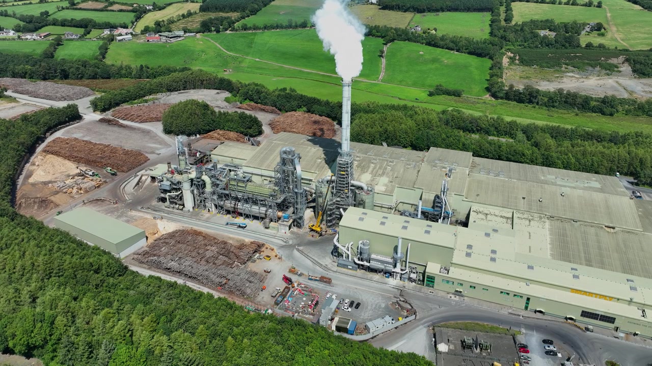 aerial view of workings at wood processing plant stockpile of logs turned to chipboard in Waterford Ireland epic Locations