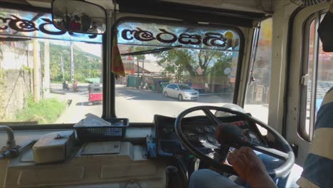 interior shot of bus speeding down rural road in sri lanka