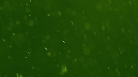 white swirling particles against a green background