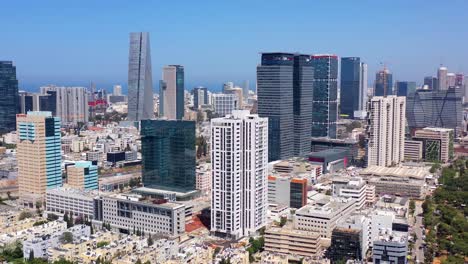 aerial view of a modern city skyline with skyscrapers and sea