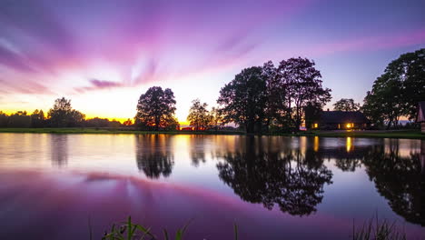 four month time lapse of a farmhouse by a lake from autumn to winter