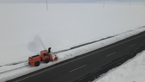 snowblower on snowy road