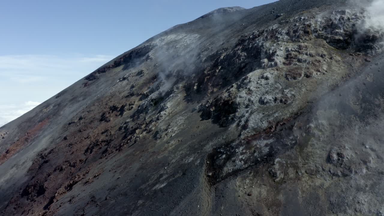 Close up of smoke and waterdamp leaving from cracks in an active volcano