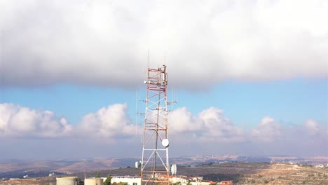 communication tower in a hilly landscape