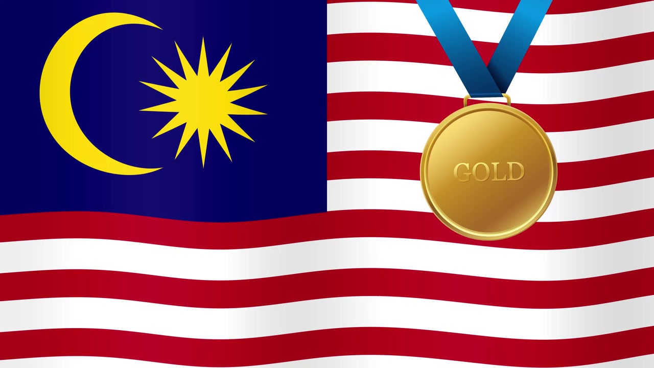 Medaglia d'oro sopra la bandiera sventolante della Malesia