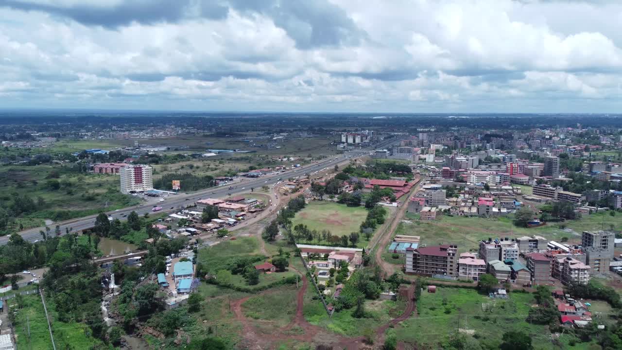 Nairobi suburb ruiru with thika road highway, scattered buildings, and green spaces, aerial view