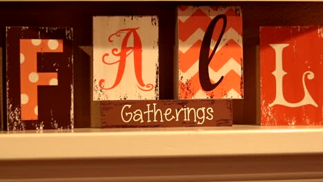 Video-of-orange,-white,-and-brown-fall-gatherings-signage