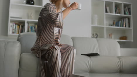 woman start working home with coffee cup. manager at cozy remote workplace alone