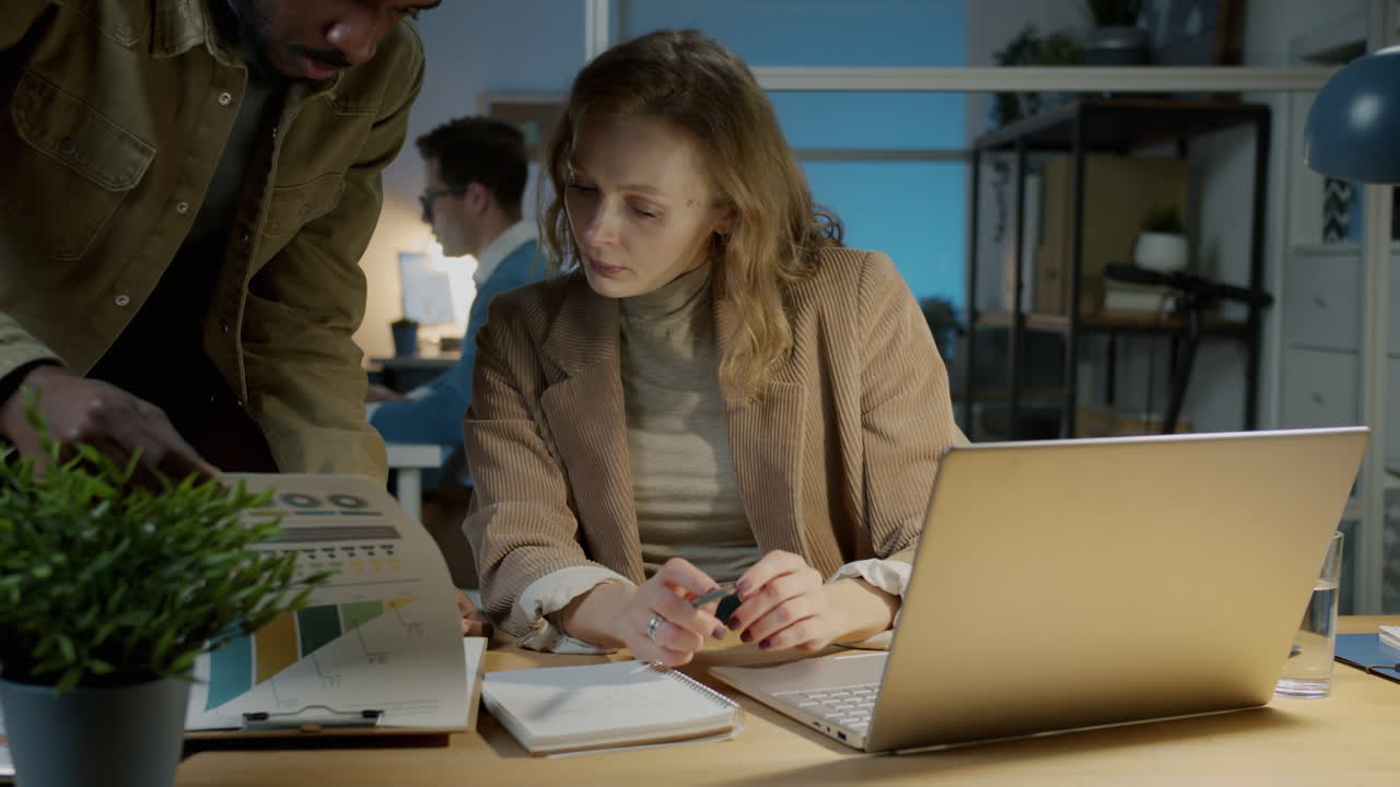 Business Colleagues Collaborating Late Night