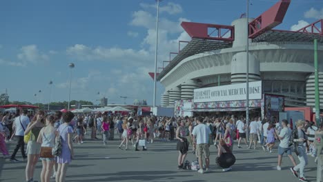 large crowd gathers outside stadium for taylor swift eras tour merchandise