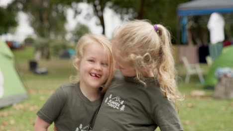 Family,-camp-and-face-of-girl-children-hug