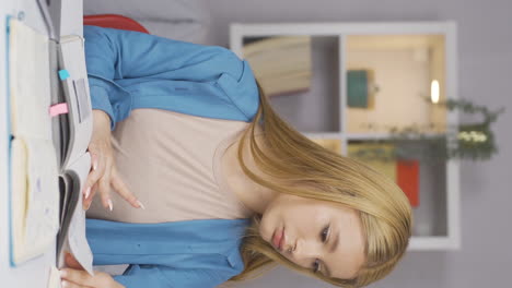 Vertical-video-of-Bored-Female-student.