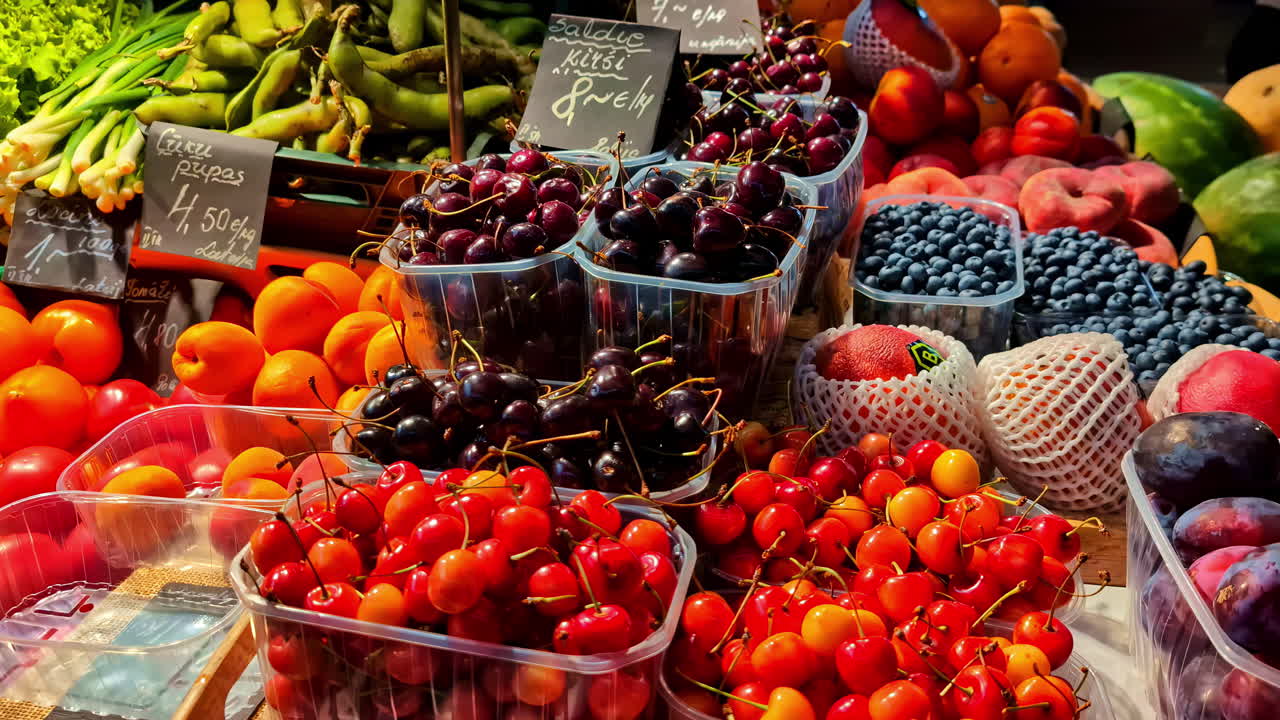Colorful fresh fruit and vegetables displayed at outdoor farmers market stand
