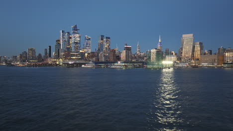 aerial view of midtown manhattan and the hudson river at night