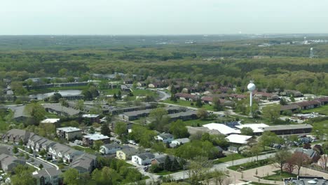 aerial shot with slight horizontal panning motion across a modern suburban area near willowbrook, in the western suburbs of chicago, illinois