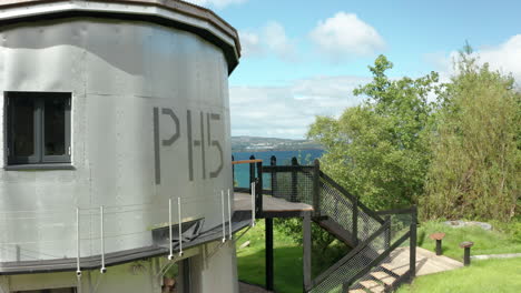 AERIAL---Flying-from-a-wide-to-the-balcony-of-the-quirky-aluminium-Scottish-house