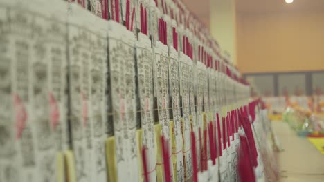 rows of ceremonial paper offerings in a temple