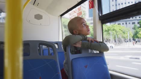 mixed race woman taking the bus