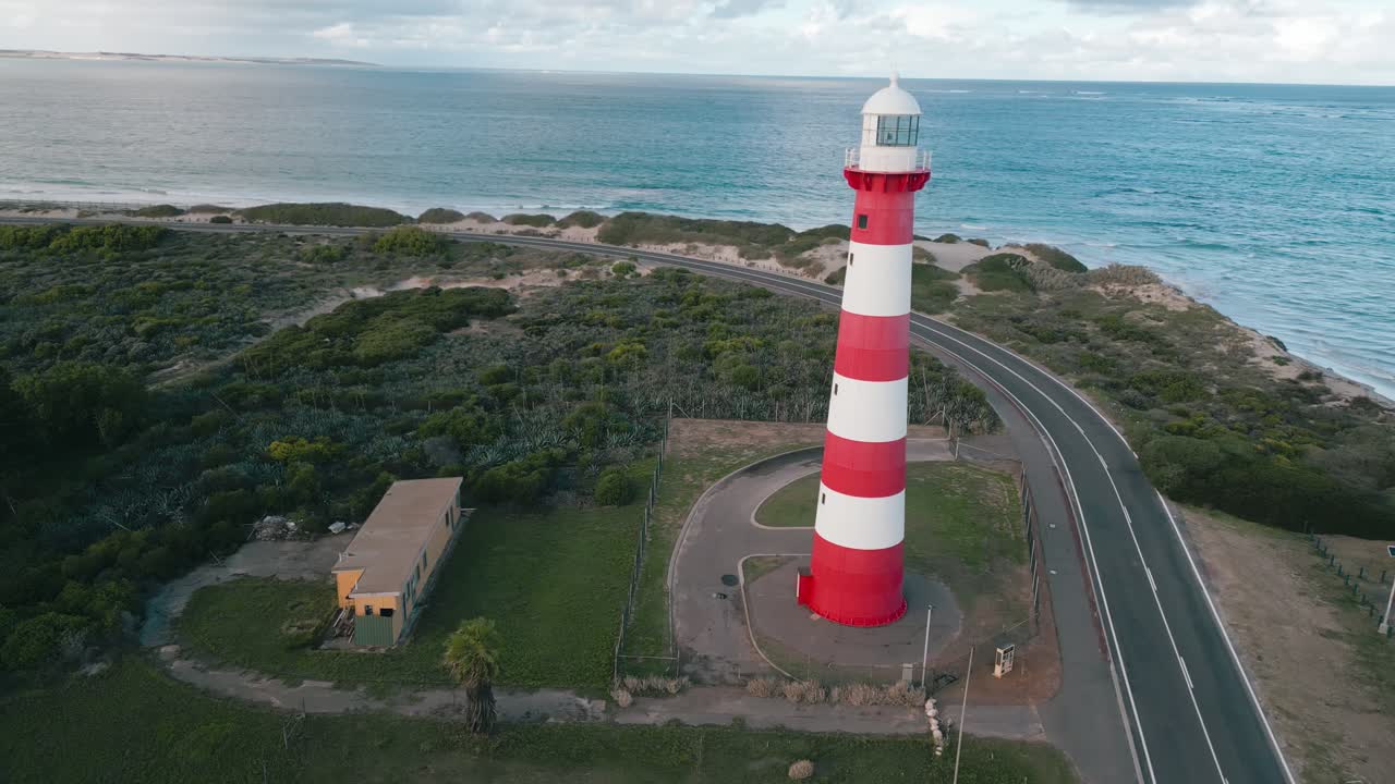 Cinematic aerial footage panning around the Point Moore Lighthouse in Geraldton, Western Australia. The lighthouse serves ships in the Indian Ocean in the vicinity of Geraldton