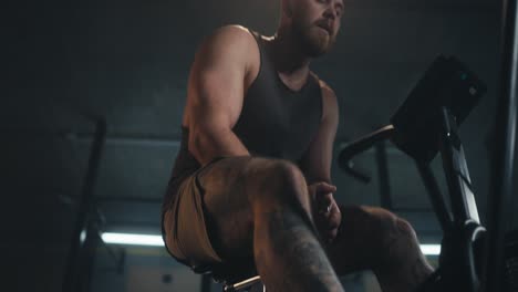 man working out on an air bike in the gym