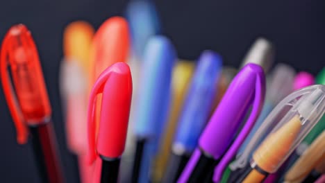 a set of colored pens rotates. art and creativity.