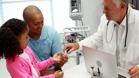 Male-doctor-checking-patient-blood-pressure