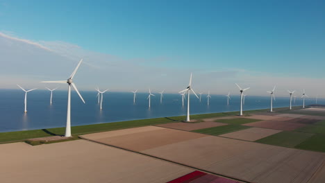 rotating offshore wind turbines in netherlands at summer