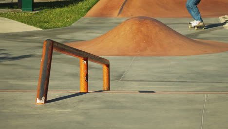 skateboarder grinding a rail at a skate park