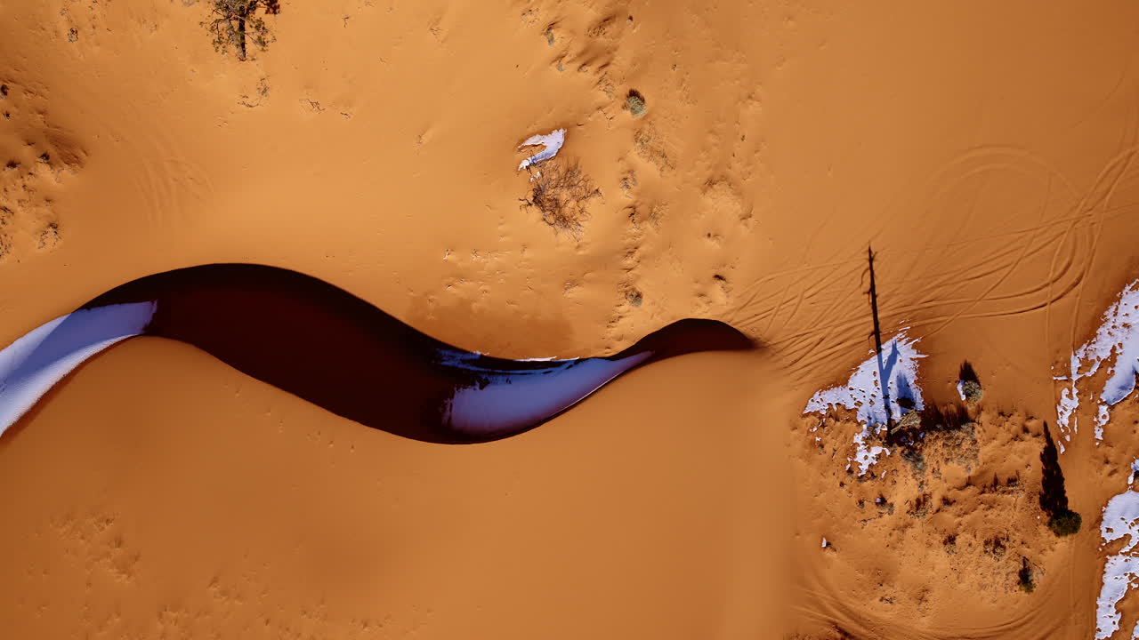 Top-down drone footage of southern Utah’s pink dunes reveals mesmerizing natural color palettes.
