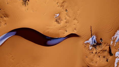 top-down drone footage of southern utah’s pink dunes reveals mesmerizing natural color palettes.