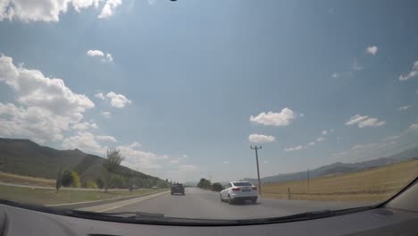 city, nature and traffic view from the camera inside the vehicle.